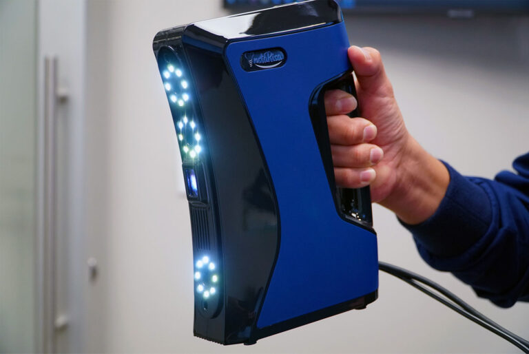 someone holding a InstaRisa Facial Scanner