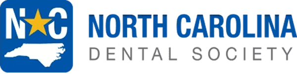 The logo of the North Carolina Dental Society features a blue square containing white letters 